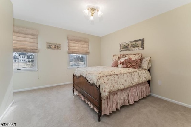 bedroom featuring carpet floors and baseboards