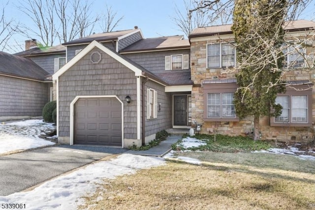 view of front facade with a front lawn and a garage