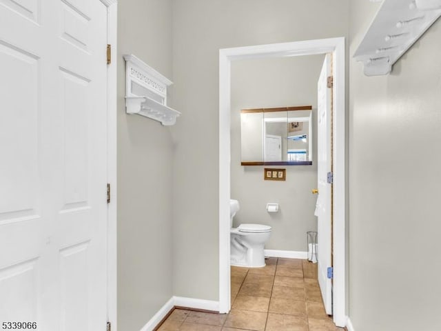 bathroom featuring tile patterned floors and toilet