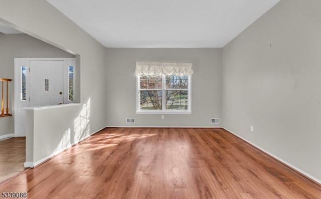 unfurnished room featuring light hardwood / wood-style flooring