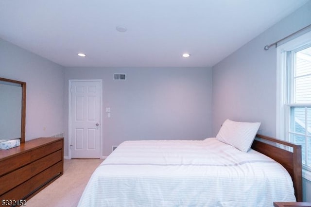 bedroom featuring recessed lighting, visible vents, and light colored carpet