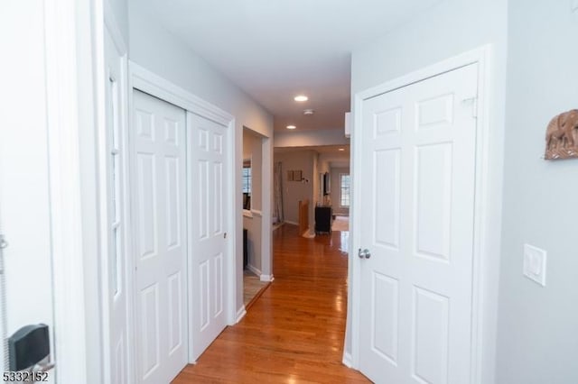 hallway with recessed lighting and light wood-style floors