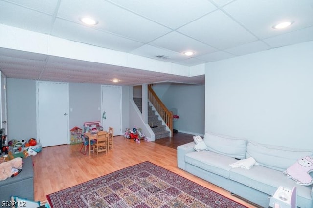 playroom featuring visible vents, wood finished floors, a paneled ceiling, and recessed lighting