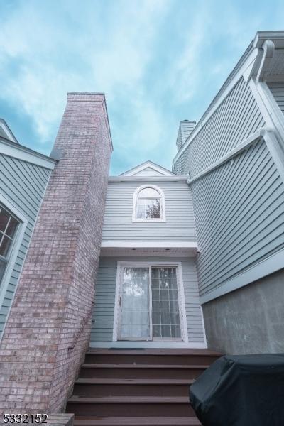 view of home's exterior featuring a chimney