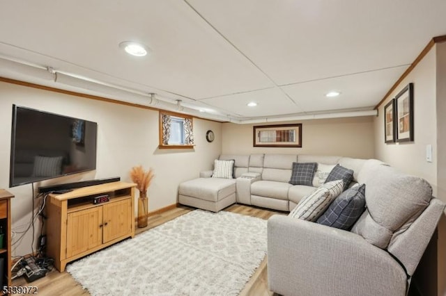 living area with light wood-style floors and recessed lighting