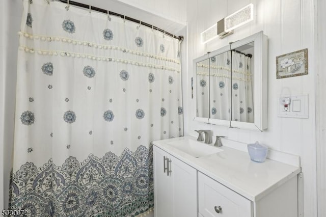 bathroom featuring vanity and a shower with curtain