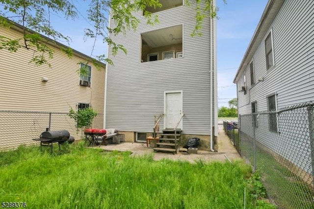 rear view of house featuring a patio