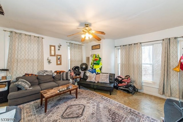 living area featuring a ceiling fan