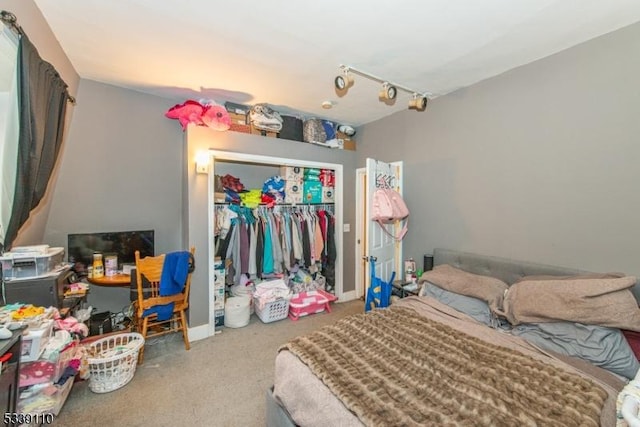 bedroom with a closet and carpet flooring