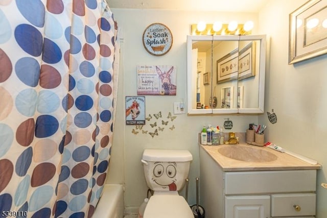 bathroom featuring vanity and toilet