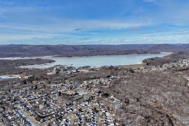 bird's eye view with a water and mountain view