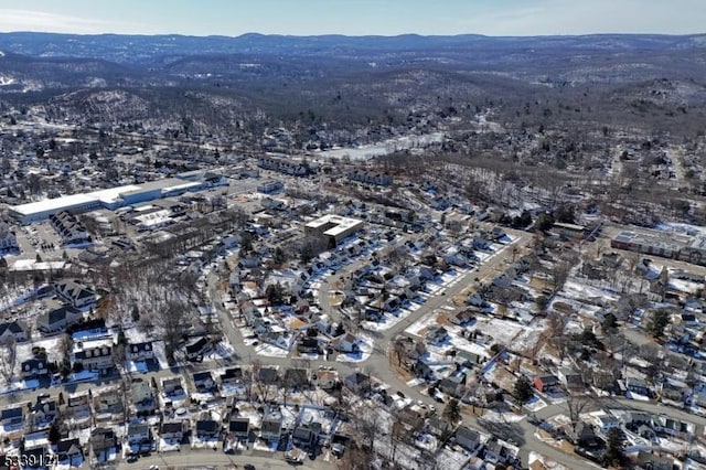 birds eye view of property featuring a mountain view