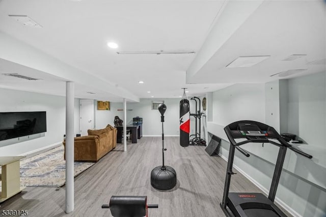 exercise area featuring light hardwood / wood-style floors