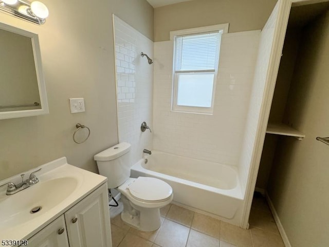 full bathroom featuring tile patterned floors, toilet, vanity, and tiled shower / bath