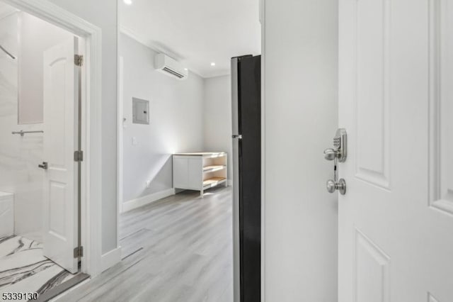 bathroom featuring recessed lighting, a wall unit AC, wood finished floors, and baseboards