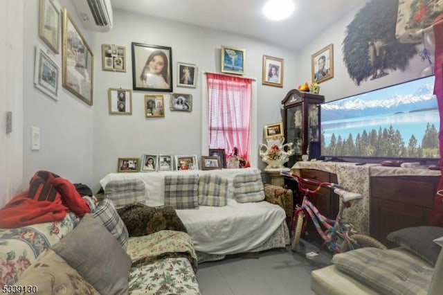 living area with an AC wall unit