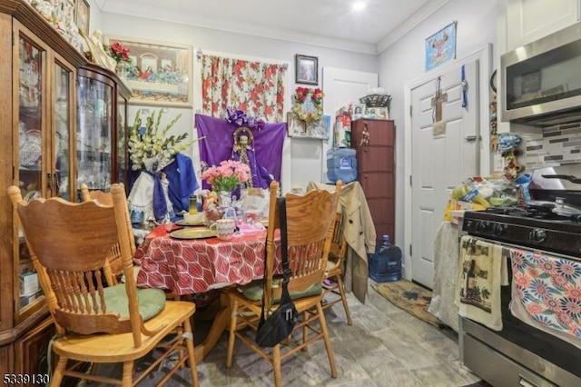 dining area featuring crown molding