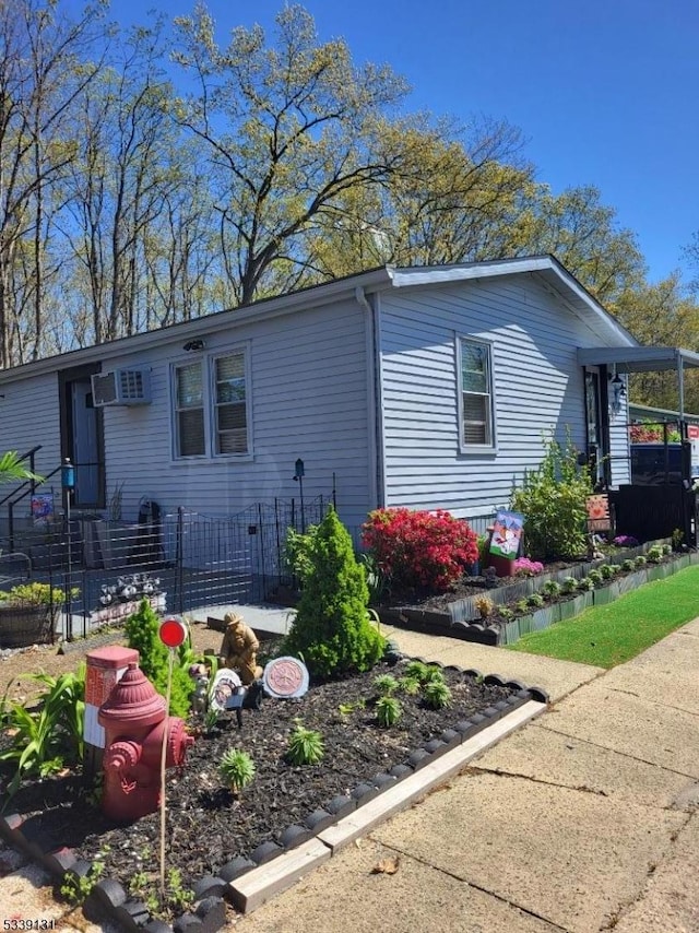 52 Douglas Dr, Jackson Twp, NJ 08527 - view of side of property with fence and a wall unit AC