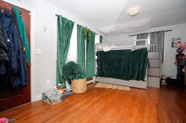 bedroom featuring wood finished floors