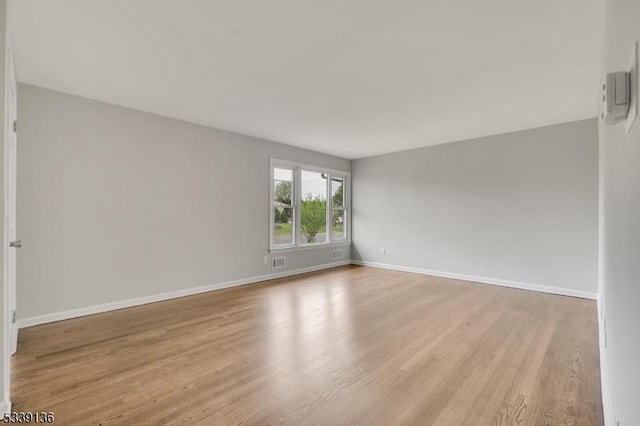 166 E Camplain Rd, Manville Boro, NJ 08835 - unfurnished room featuring light wood finished floors and baseboards