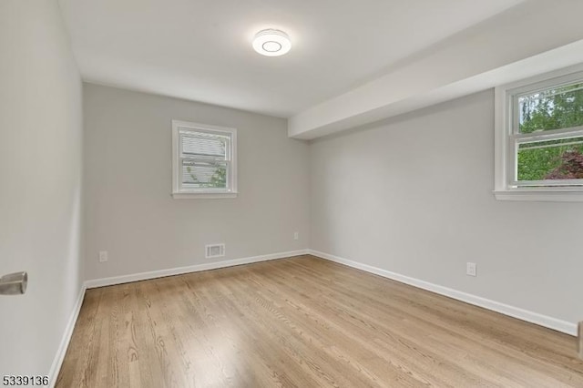166 E Camplain Rd, Manville Boro, NJ 08835 - spare room featuring wood finished floors and baseboards