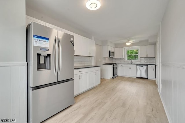 166 E Camplain Rd, Manville Boro, NJ 08835 - kitchen featuring stainless steel appliances, ceiling fan, tasteful backsplash, white cabinetry, and a sink