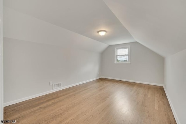 166 E Camplain Rd, Manville Boro, NJ 08835 - bonus room with wood finished floors, vaulted ceiling, and baseboards