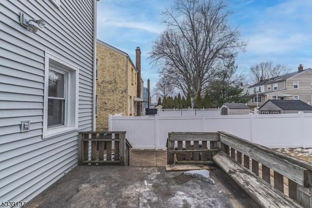 view of patio / terrace featuring fence