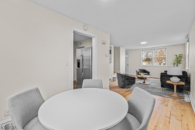 dining area with wood finished floors