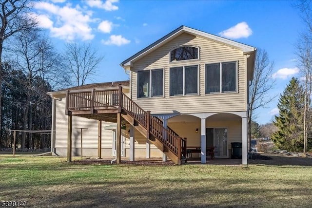 back of house featuring a patio area, stairway, a yard, and a deck