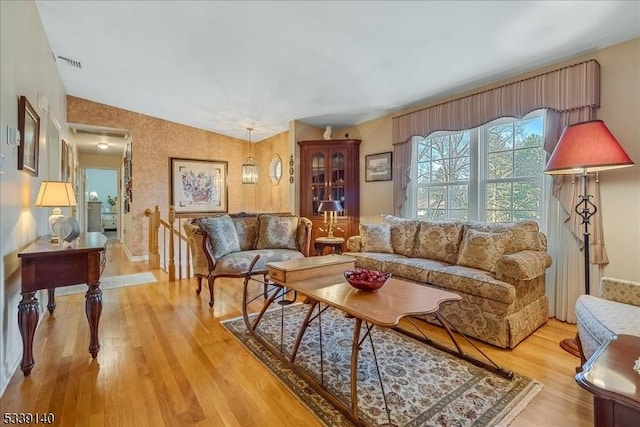 living room with visible vents and light wood finished floors