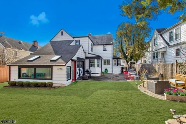 exterior space featuring a patio, a yard, and fence