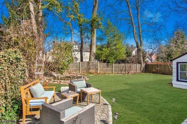 view of yard with a fenced backyard, outdoor lounge area, and a patio