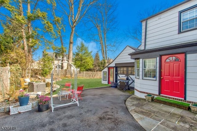 view of patio featuring fence