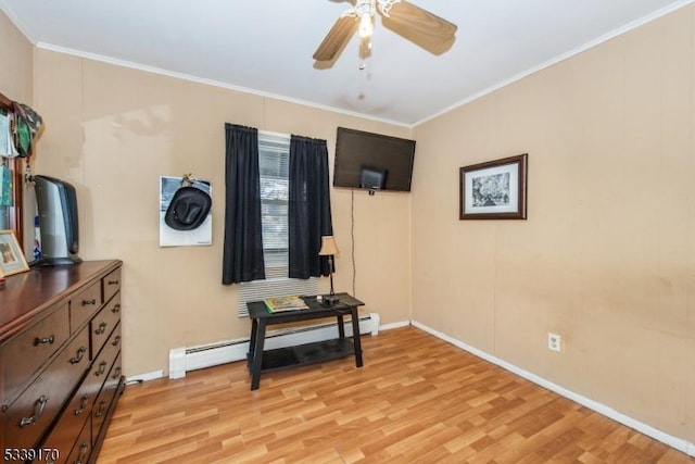 interior space with a ceiling fan, crown molding, light wood-style flooring, and baseboard heating