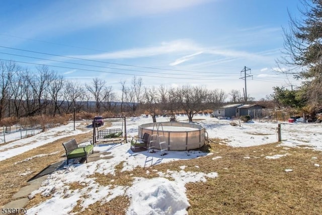 view of yard covered in snow