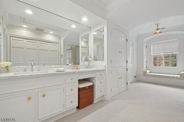 full bath featuring visible vents, ornamental molding, a closet, and vanity