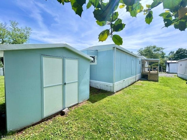 view of outbuilding with a yard