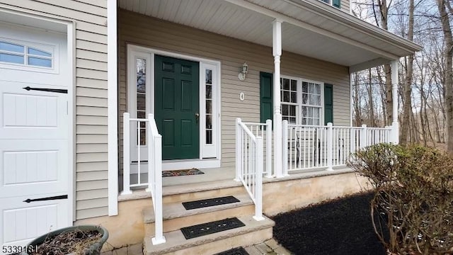 property entrance with covered porch