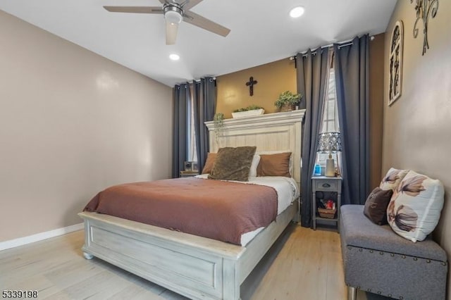 bedroom with ceiling fan, light wood finished floors, recessed lighting, and baseboards