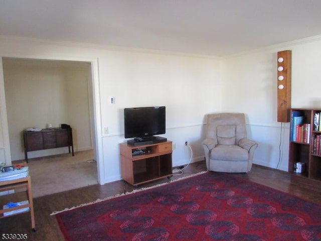 living room featuring crown molding and dark hardwood / wood-style floors