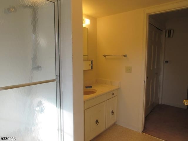 bathroom with vanity and walk in shower