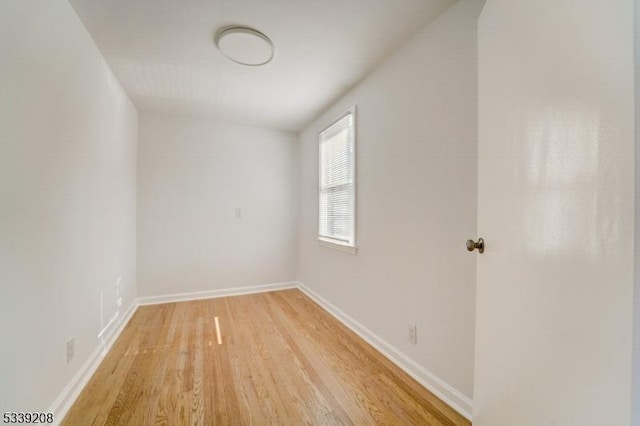 empty room featuring hardwood / wood-style floors