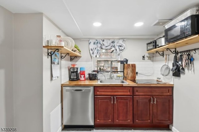 bar with sink, black appliances, and backsplash