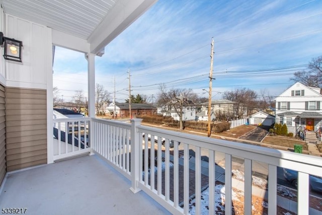 balcony with a residential view and covered porch