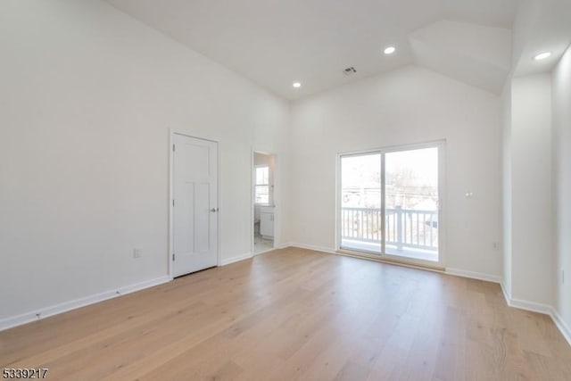 empty room with baseboards and light wood finished floors