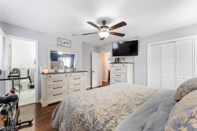 bedroom featuring a closet, visible vents, dark wood finished floors, and ceiling fan