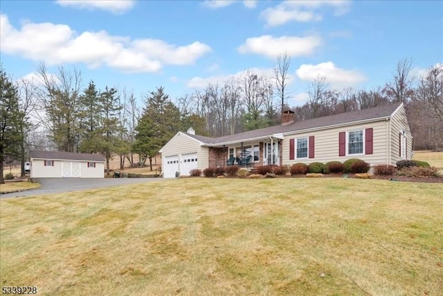 ranch-style house featuring an attached garage, a chimney, driveway, and a front yard