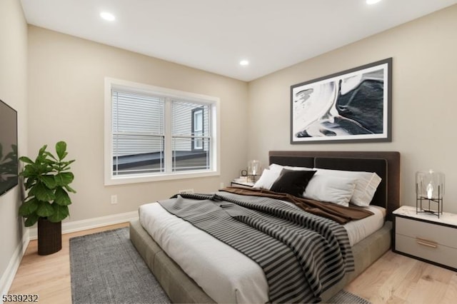 bedroom featuring recessed lighting, light wood-type flooring, and baseboards