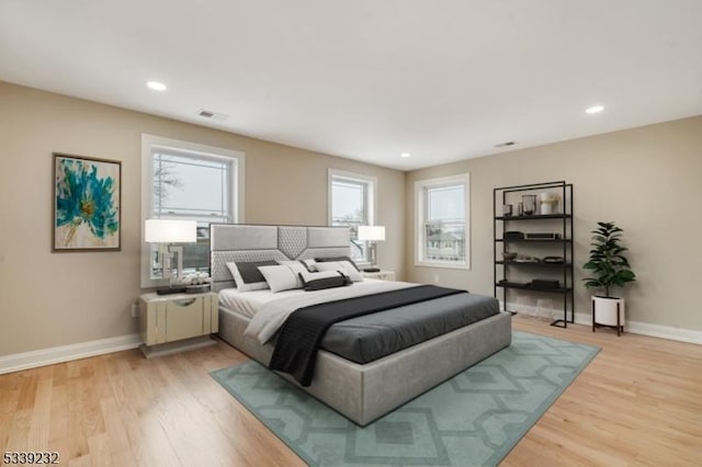 bedroom featuring recessed lighting, baseboards, visible vents, and light wood finished floors